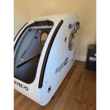 Pre-Owned OXYREVO Space60 2.0 ATA Hard Sitting Hyperbaric Chamber — Only 42 Hours Used, IN STOCK (White Exterior, Orange Chair)